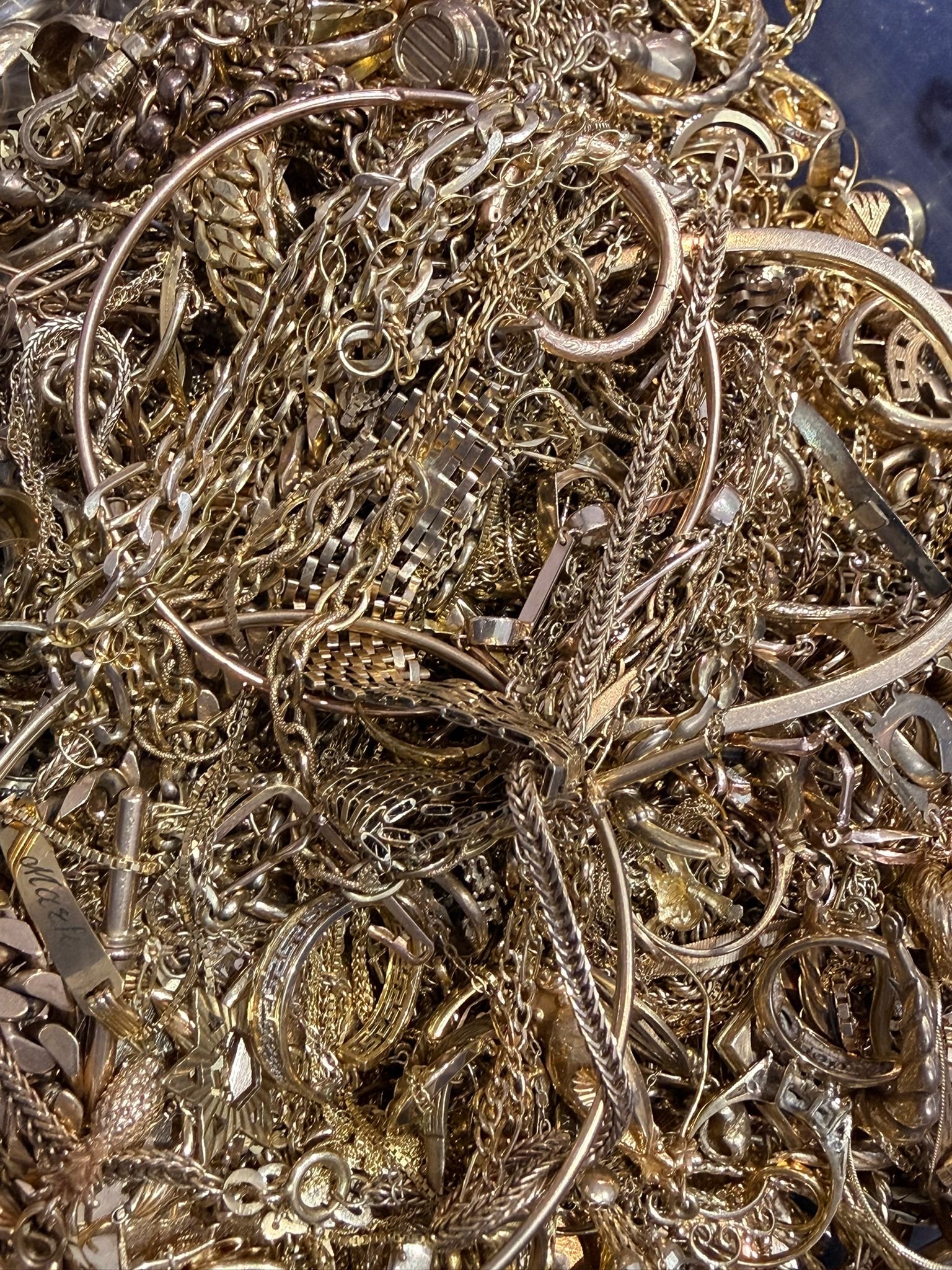 A large collection of gold jewellery including chains, rings and bangles