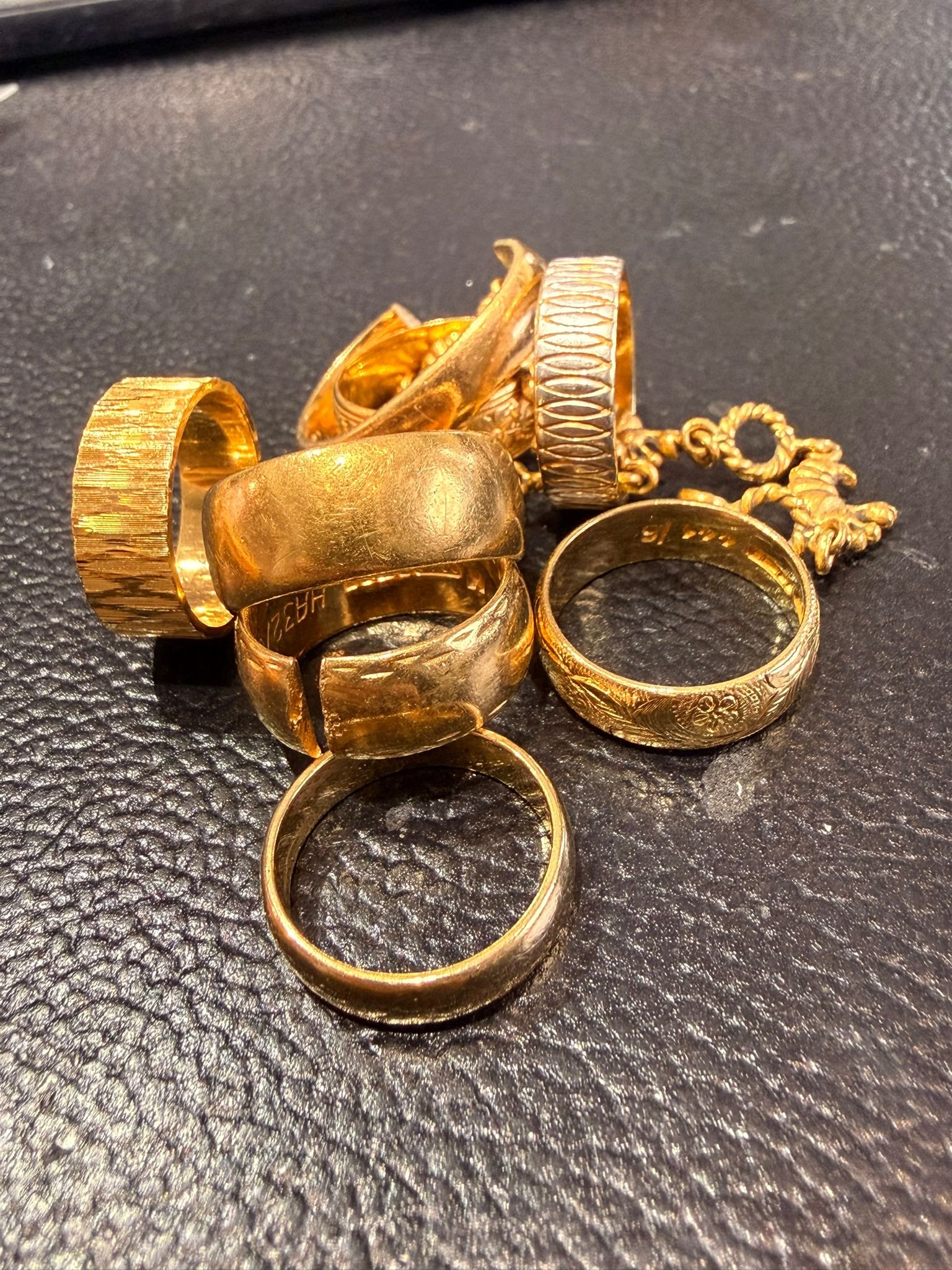 Gold jewellery sorted into labelled zip bags by carat — 9ct, 14ct, 18ct, 22ct